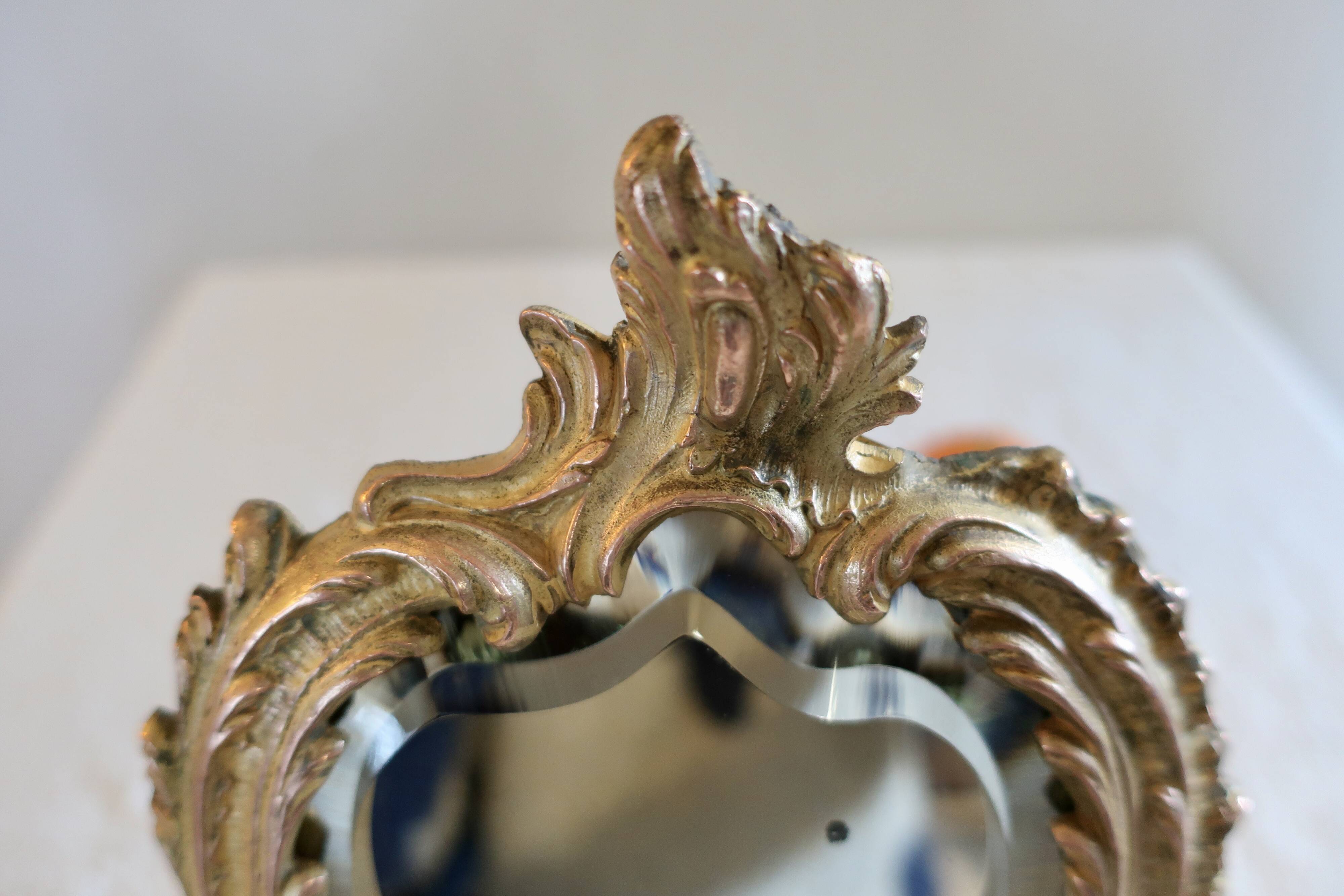 Small vintage 19th century mirror or hand mirror, bronze, beveled glass, baroque, rococo style.