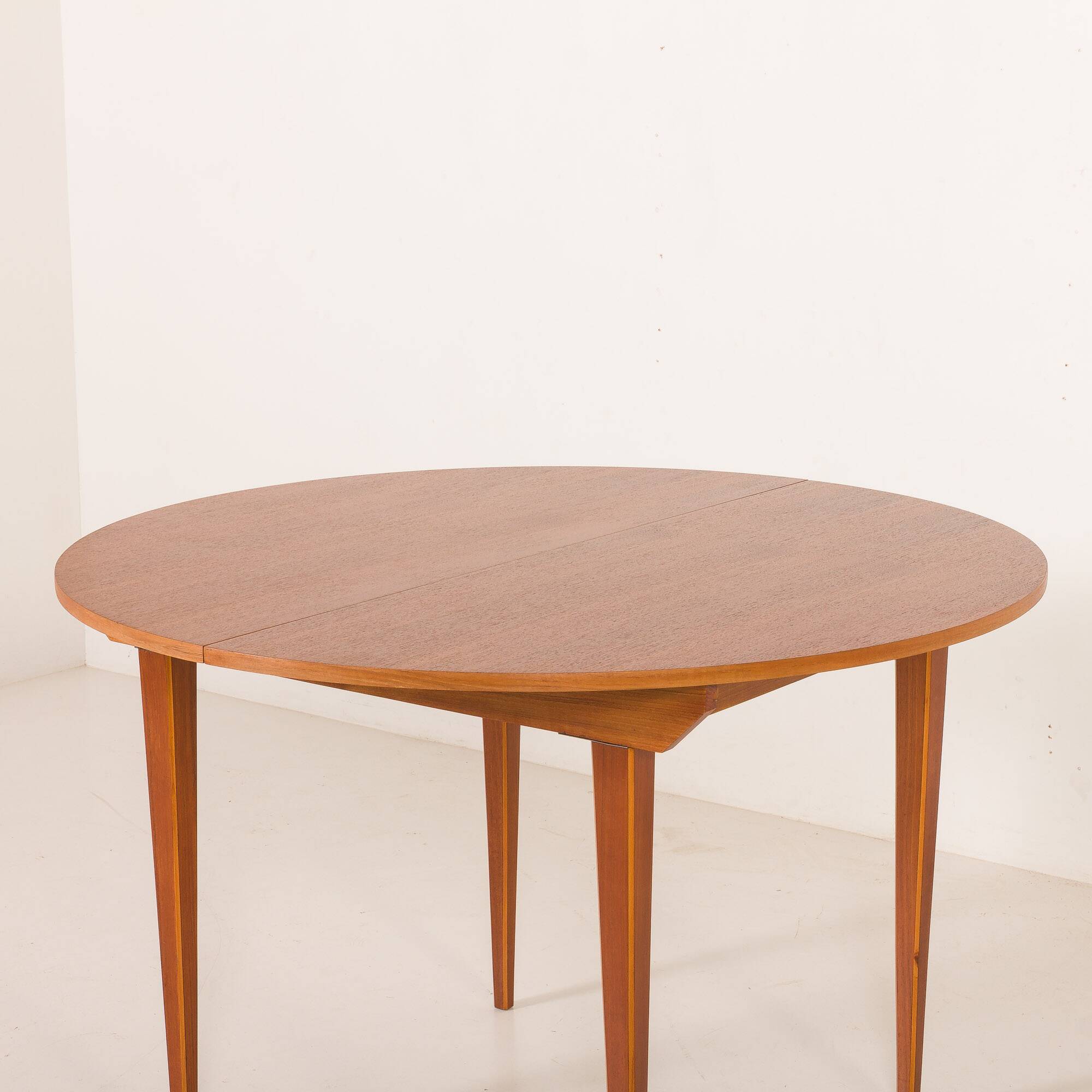 Scandinavian round teak table with hidden extension, 1970s