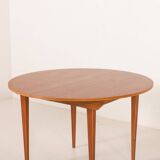 Scandinavian round teak table with hidden extension, 1970s