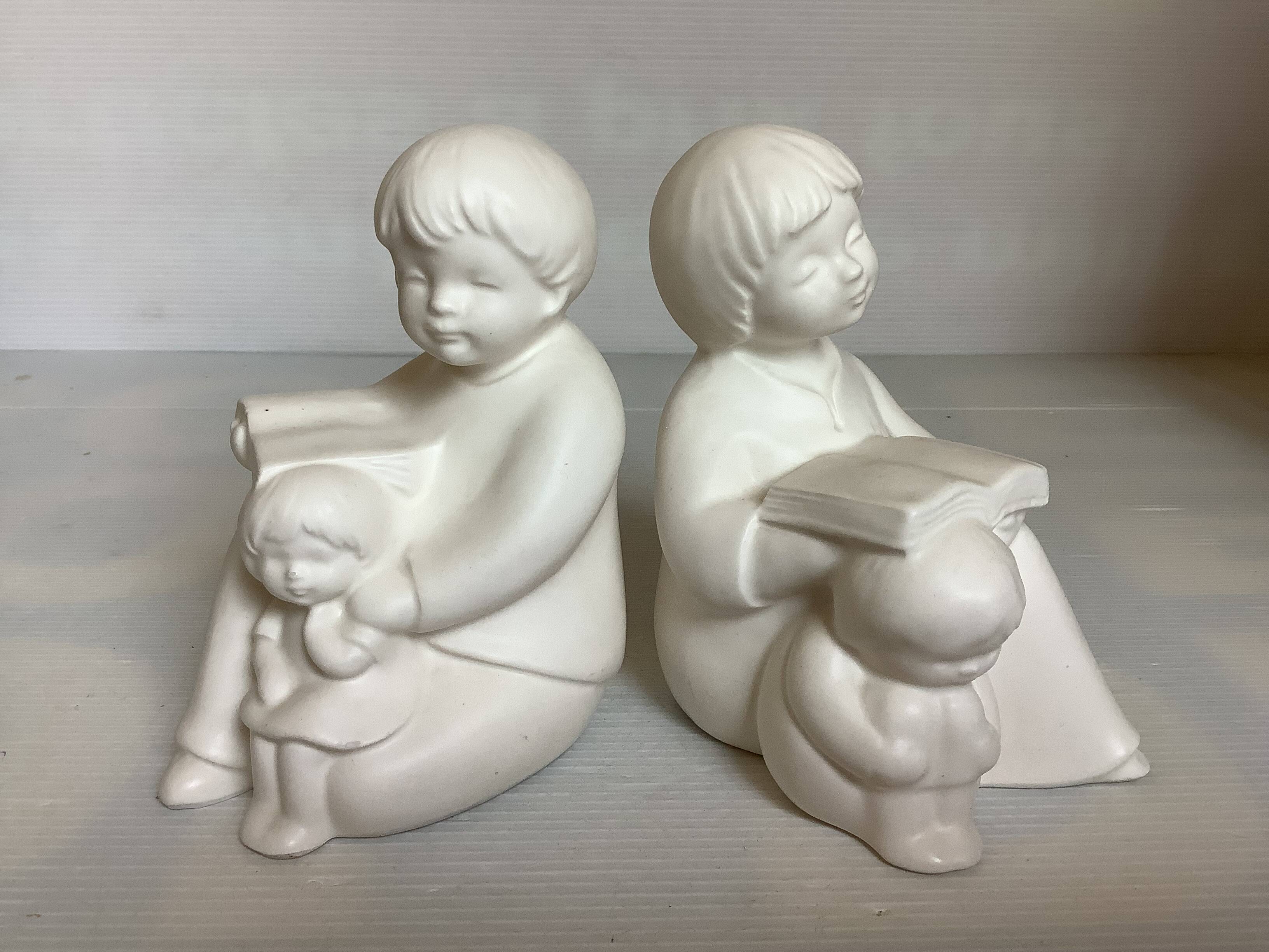 Pair of bookends with a matte white glaze for children.