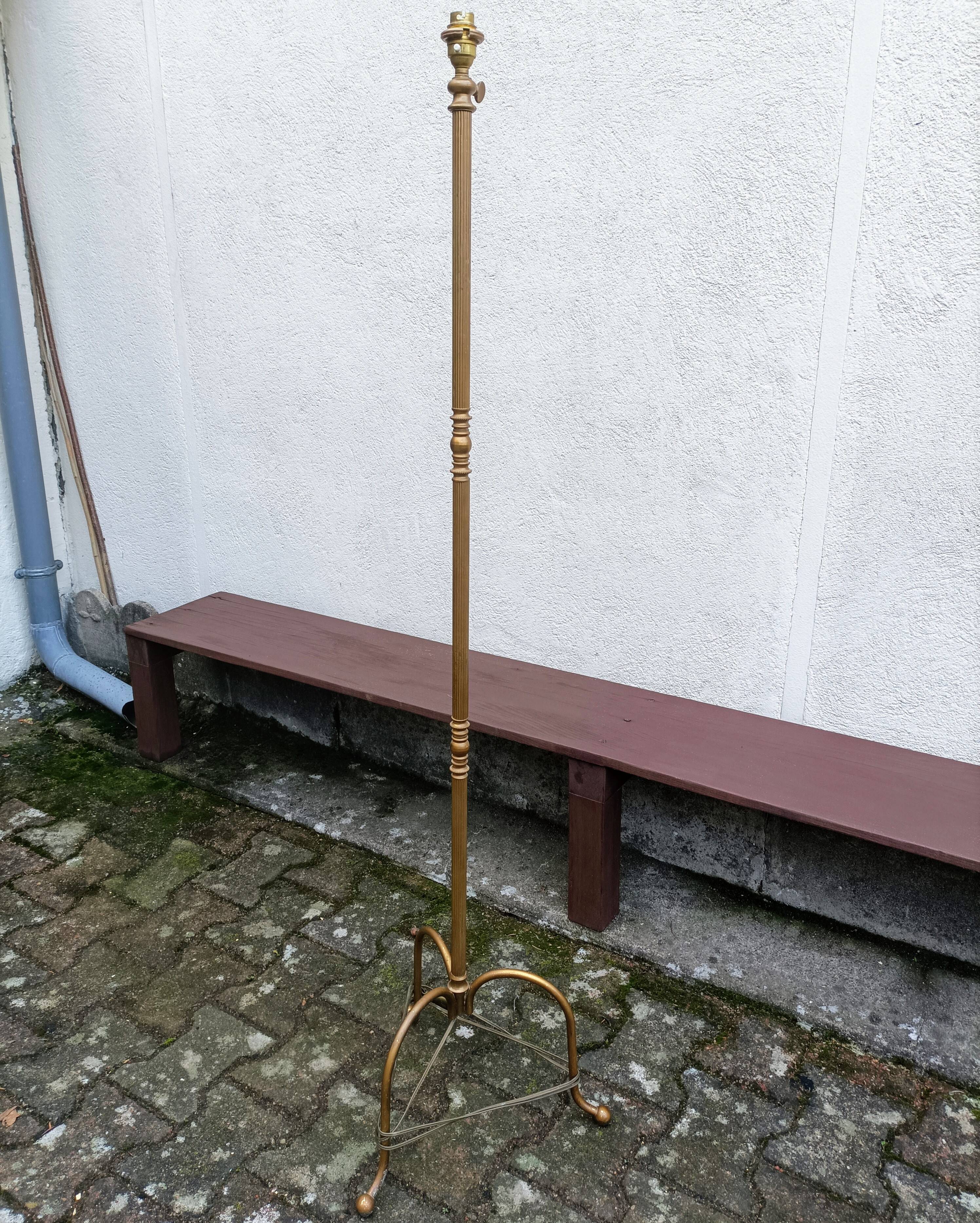 Brass tripod floor lamp