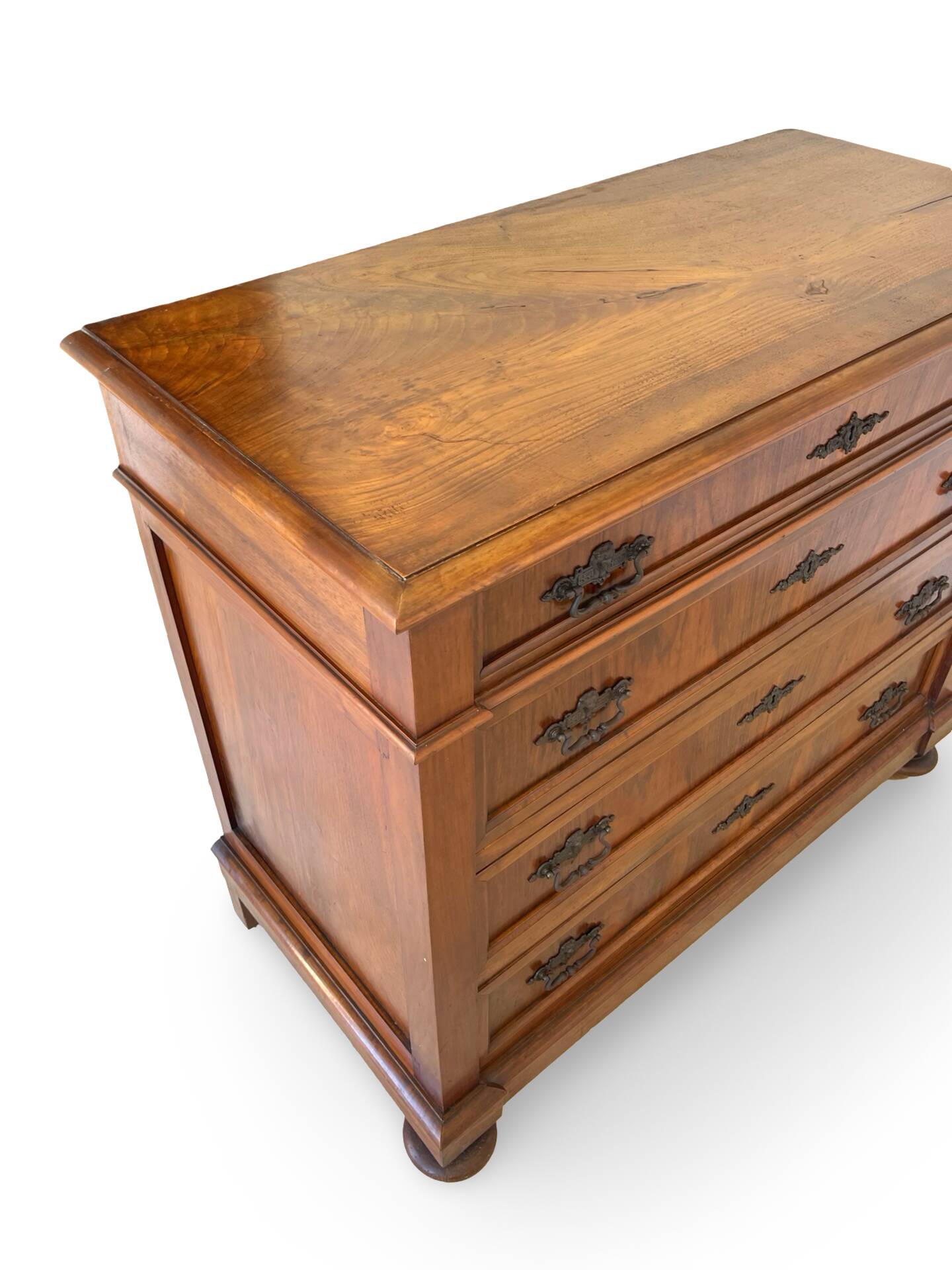 Antique walnut commode with bronze handles in the shape of a lion's mask,