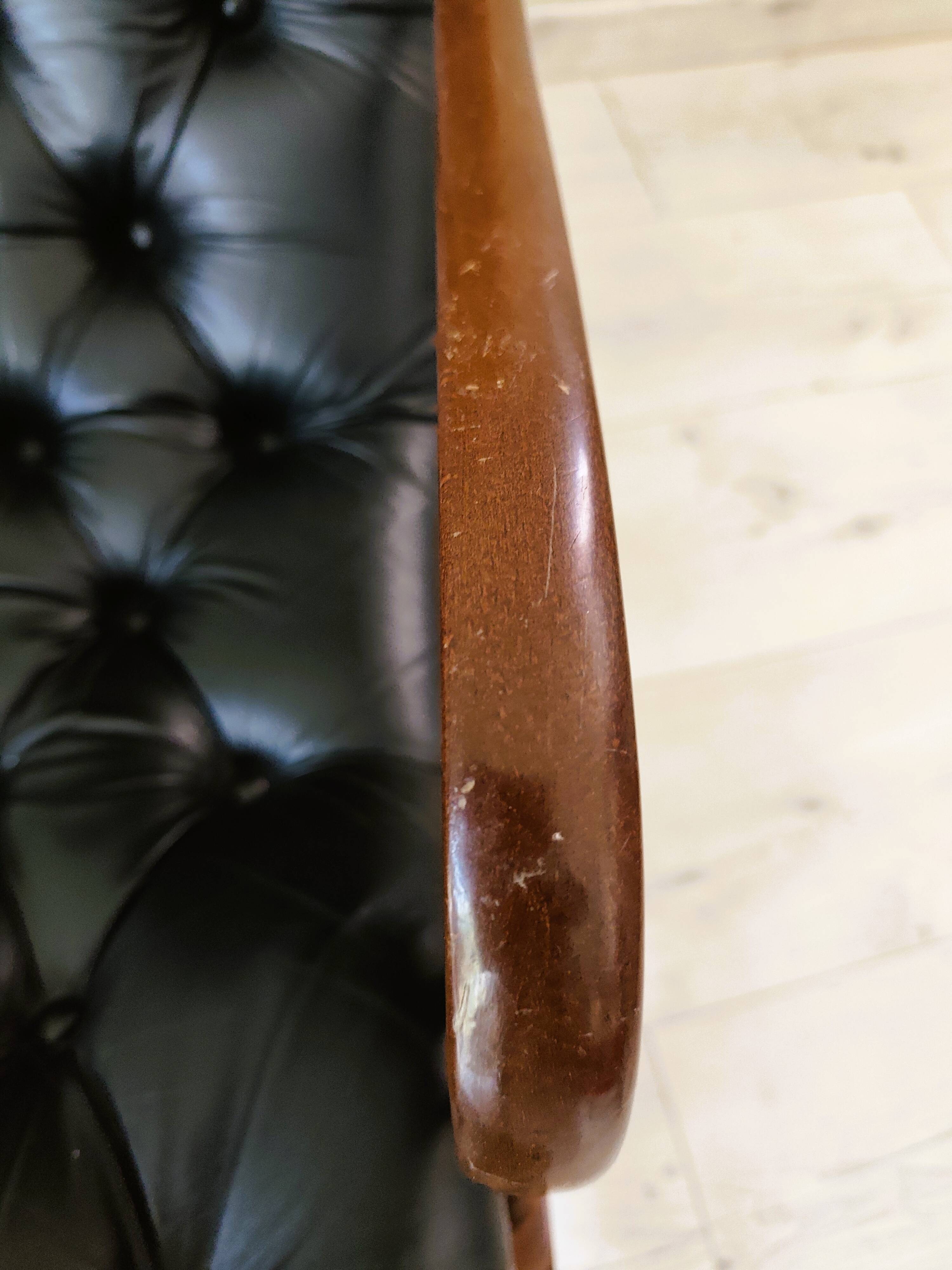 Black leather rocking Chesterfield armchair