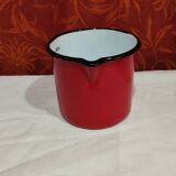 graduated measuring pitcher in red enamelled sheet metal