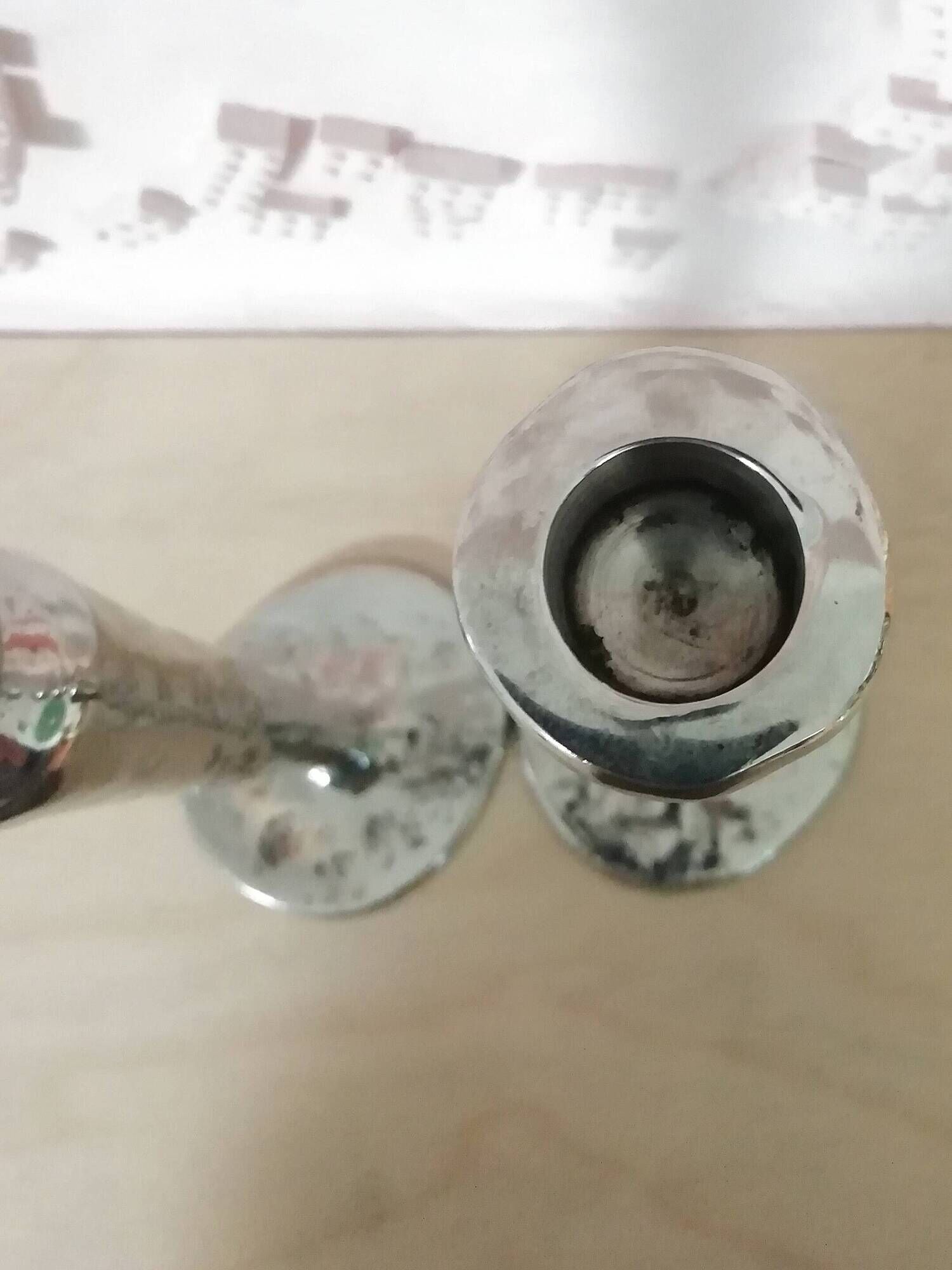 Pair of hammered metal candlesticks