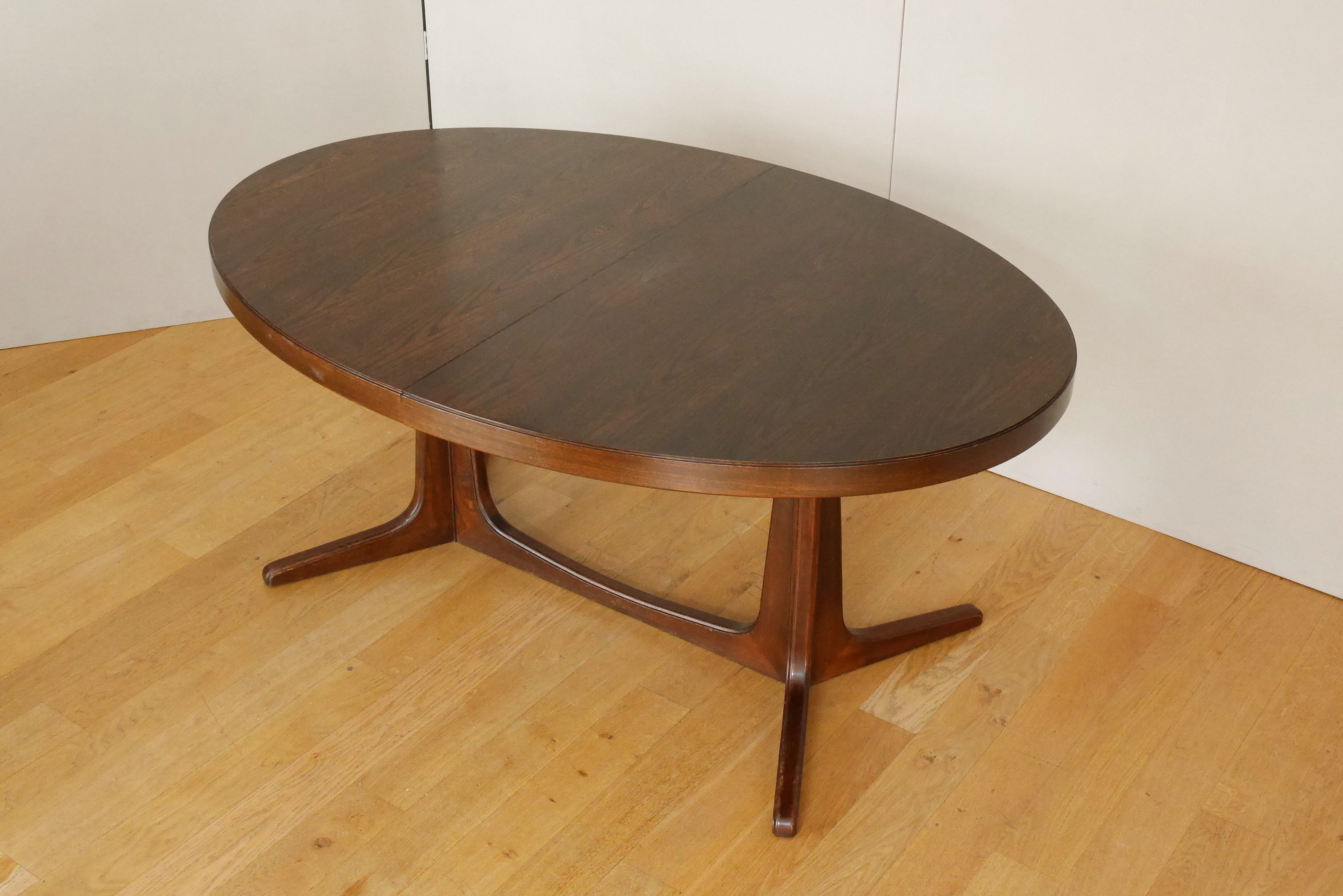 Extendable oval elm table with Baumann extensions
