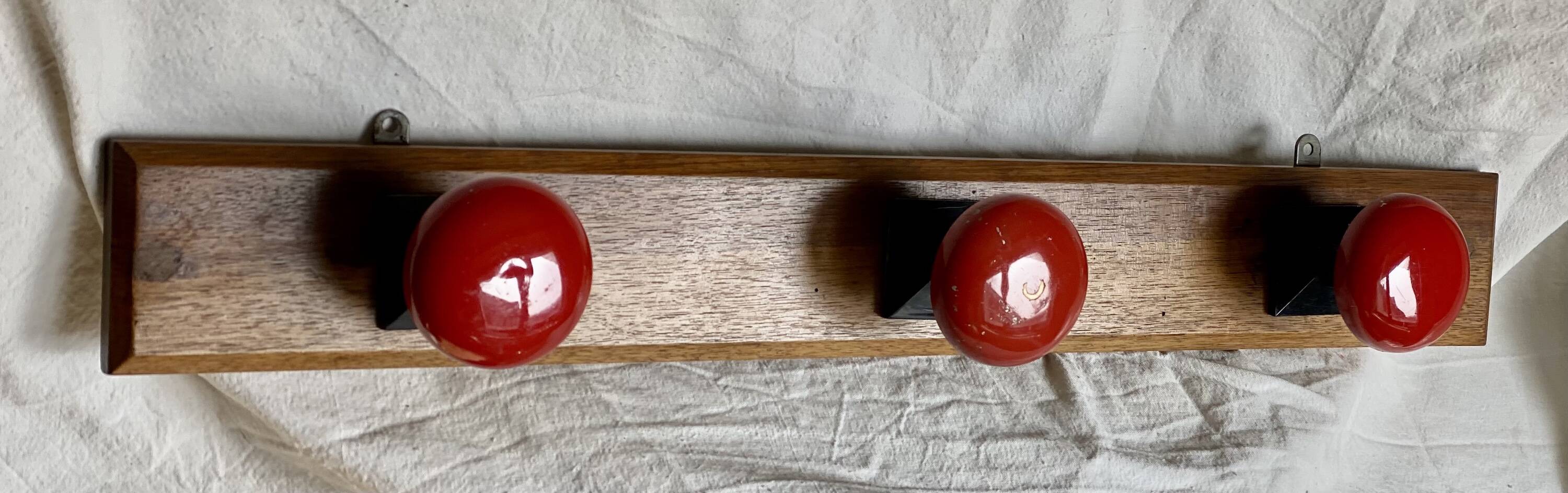 Wall-mounted coat rack with 3 hooks, vintage 1960s red lacquered metal.