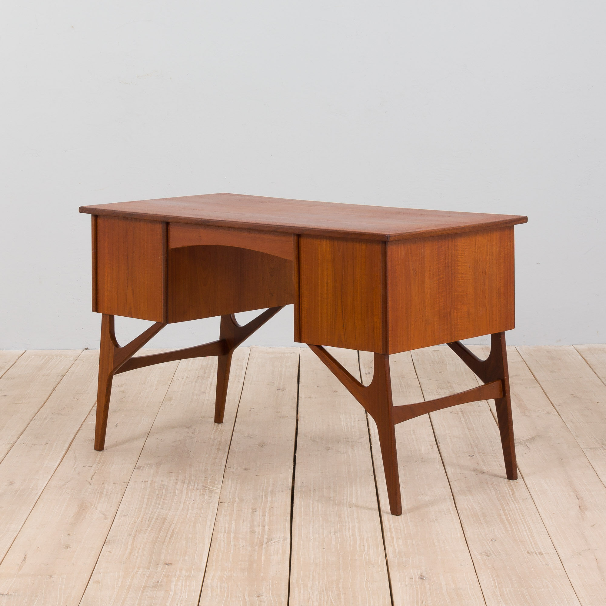 Danish mid century teak desk on sculptural base, 1960s.