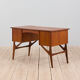 Danish mid century teak desk on sculptural base, 1960s.