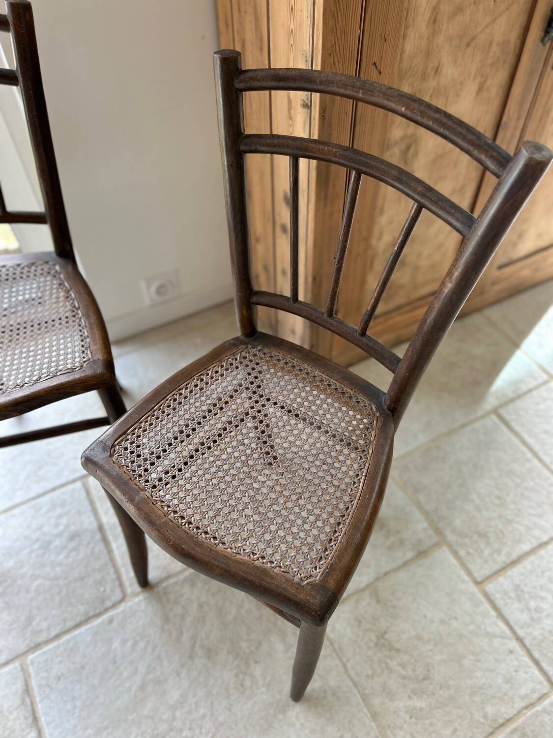 Pair of cane bistro chairs