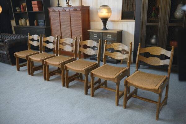 Set of 6 oak dining chairs with rush seat and 'Echelle' backrest in the style of Guillerme et Chambron 1950s