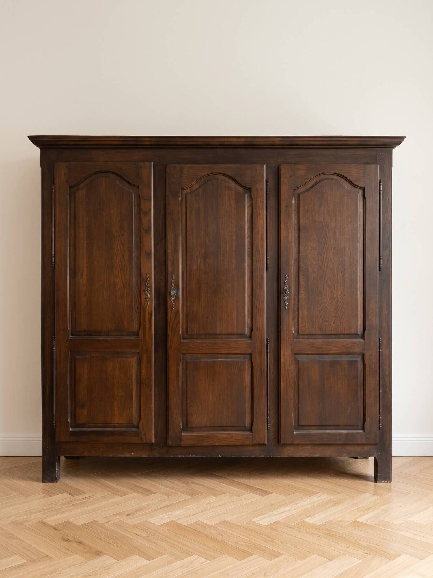 Large antique wardrobe with 3 doors made of solid wood.