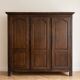 Large antique wardrobe with 3 doors made of solid wood.