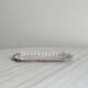 Metal butter dish and thick rectangular glass bowl.