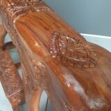 Decorative rocking elephant in carved exotic wood.