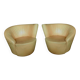 Paire de fauteuils pivotants cuir jaune accottoirs asymétriques ca 80