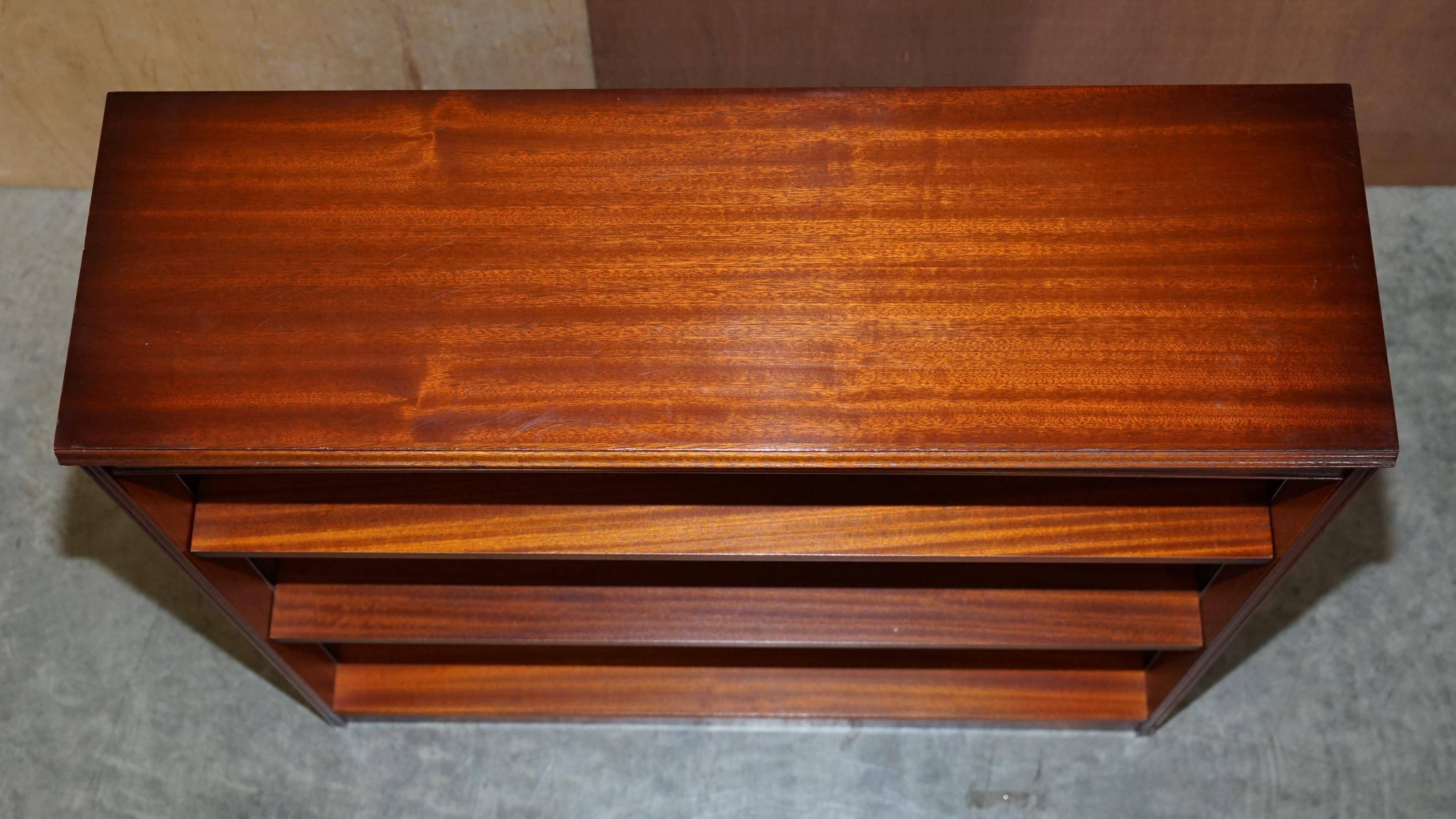 Pair of open dwarf bookshelves in mahogany by Shaws of London.