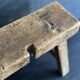 Ancient Chinese farm bench in patinated wood, small rustic stool.