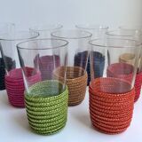 set of 9 small glasses with colored rattan support from the 70s