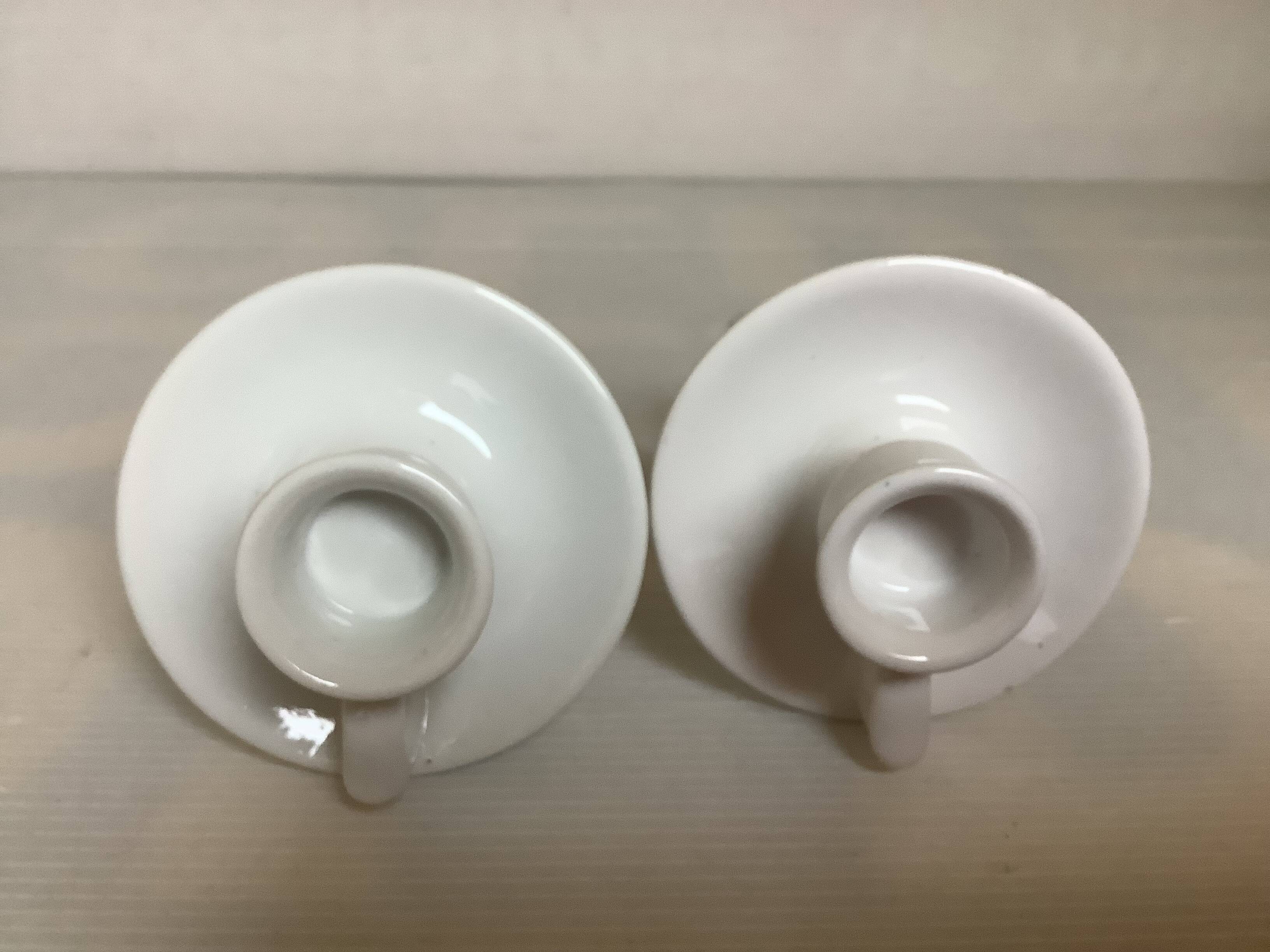 Pair of small white cellar rat candlesticks