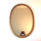 Golden mirror decorated with water leaves and palmettes