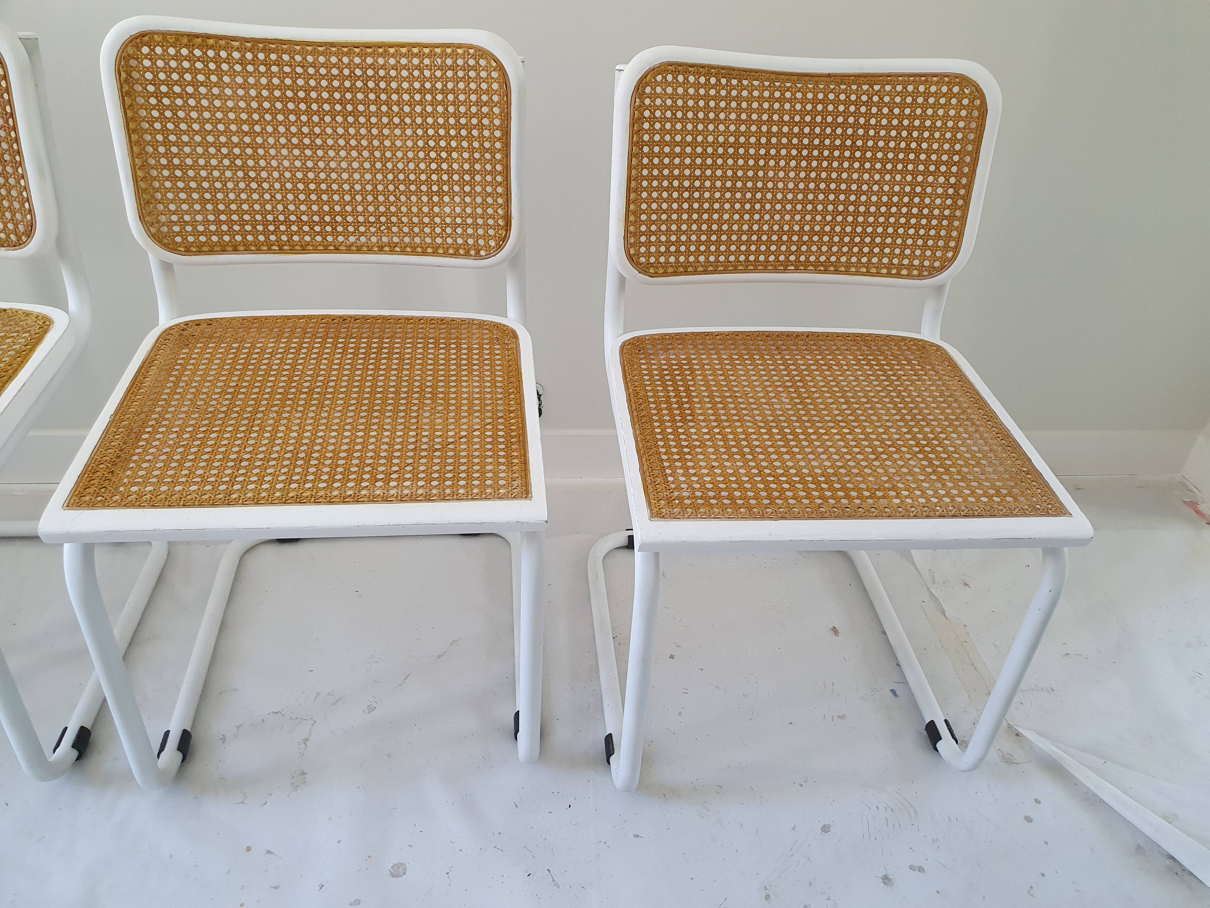 B32 chairs by Marcel Breuer in white.