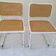 B32 chairs by Marcel Breuer in white.