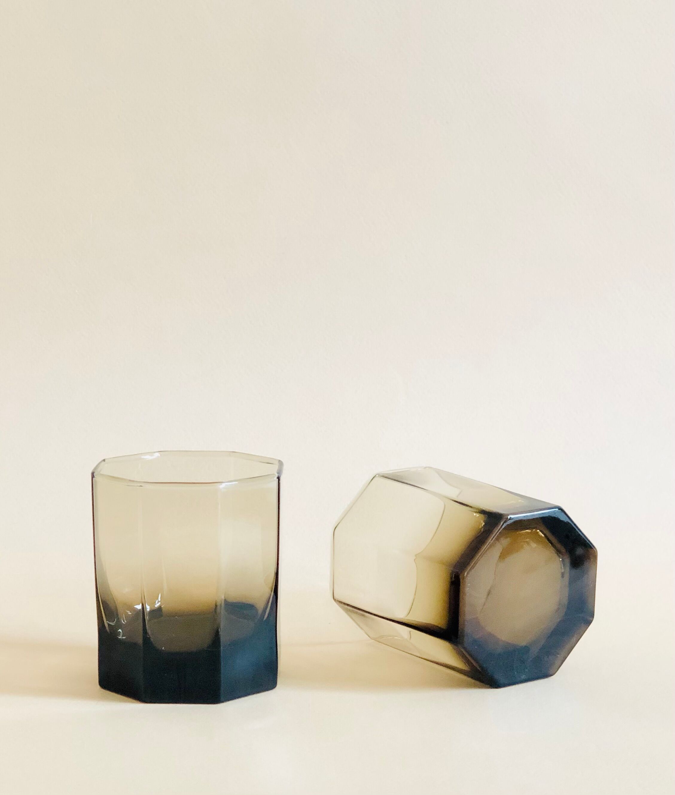 Pair of octagonal black glass whiskey glasses