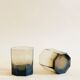 Pair of octagonal black glass whiskey glasses