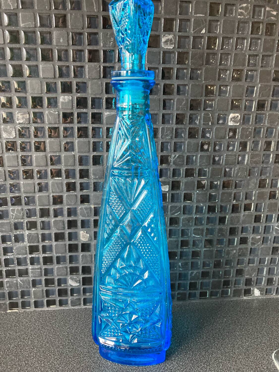 Blue chiseled glass bottle