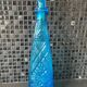 Blue chiseled glass bottle