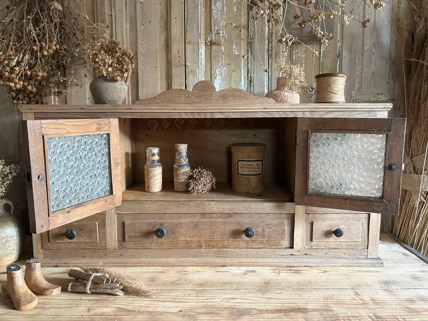 Small piece of furniture with glass doors and drawers