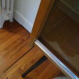 Small window on high metal feet