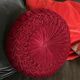 Red braided velvet cushion