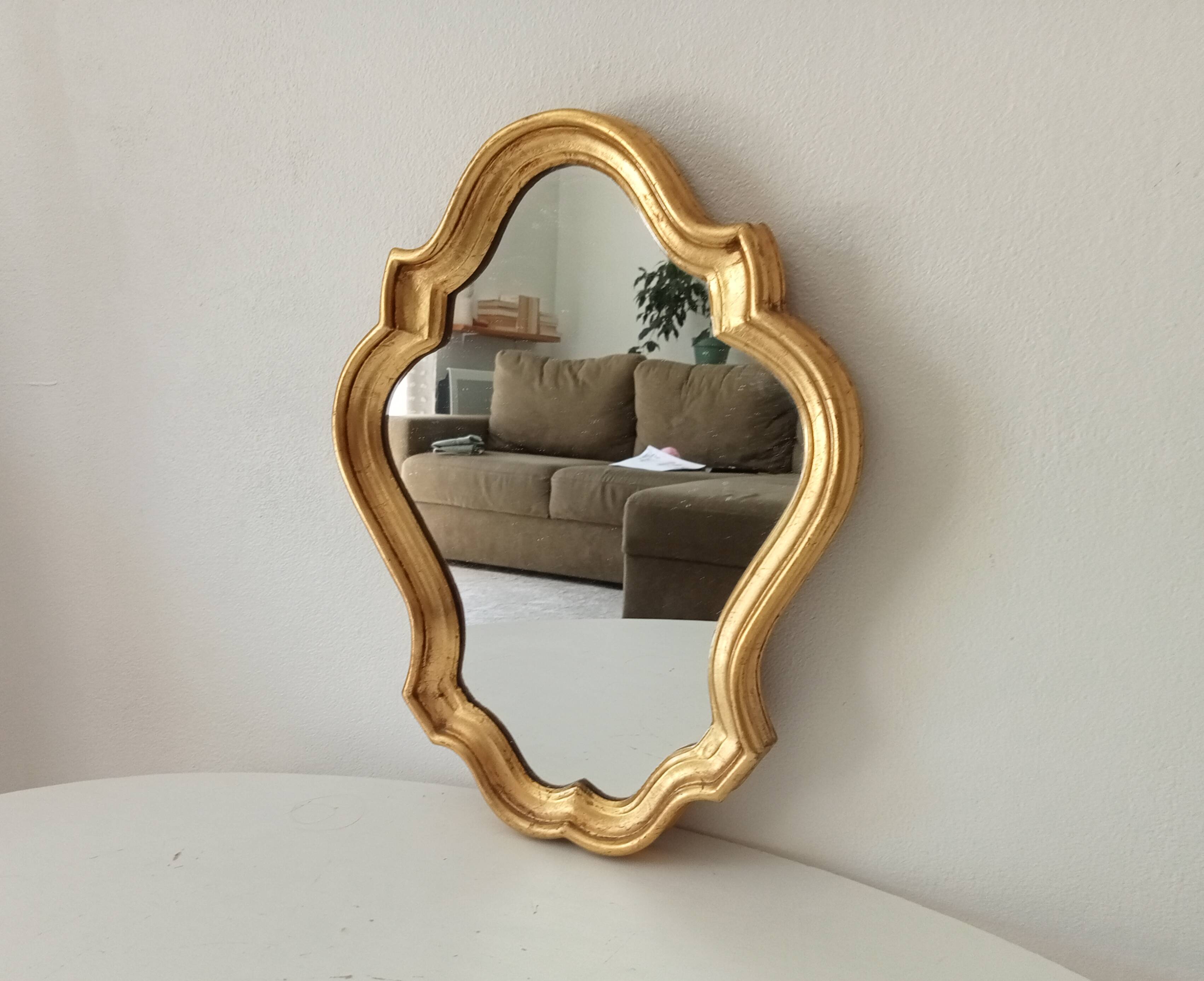 Baroque mirror in gilded wood from the 1960s.