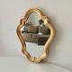 Baroque mirror in gilded wood from the 1960s.