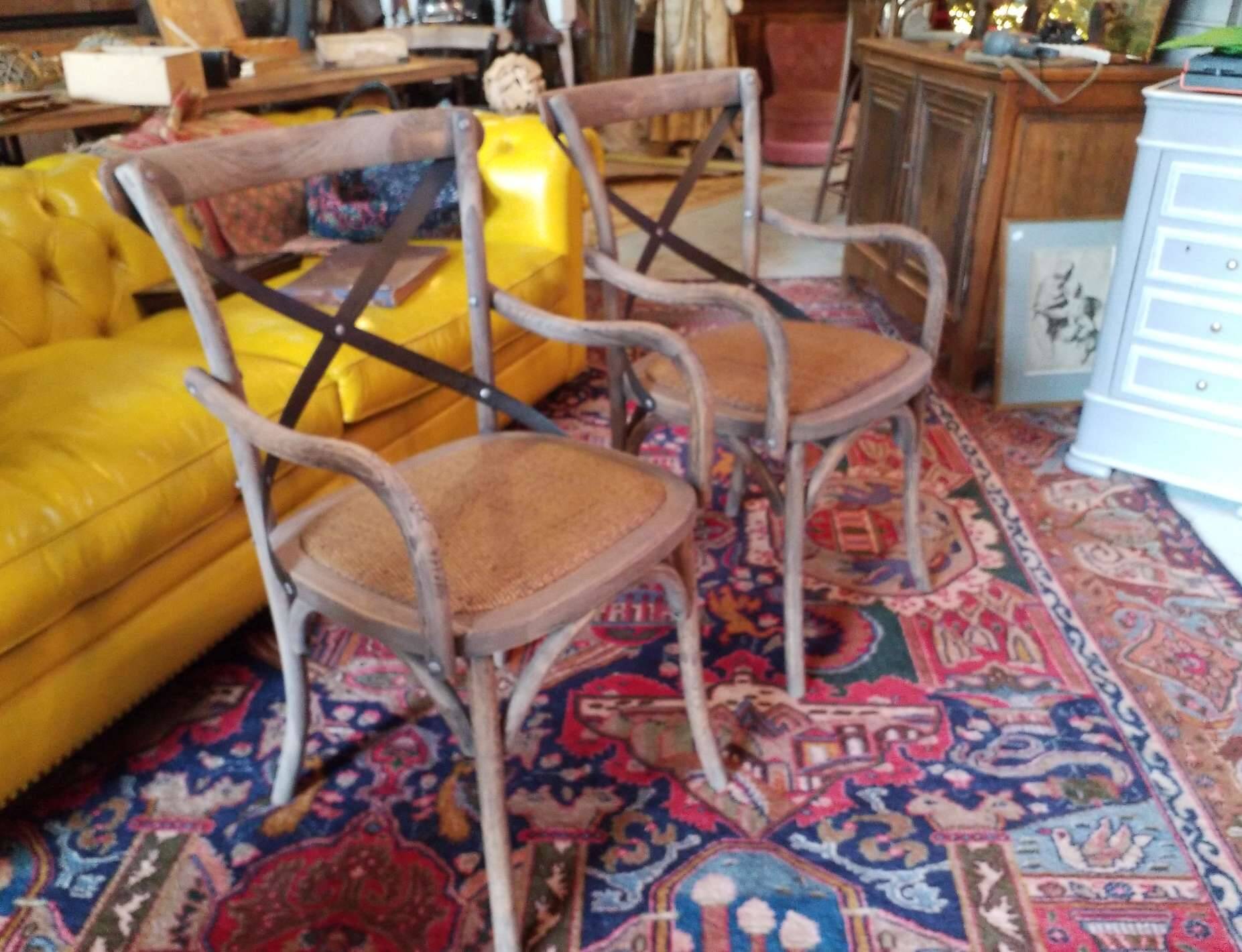 Angled wooden armchairs