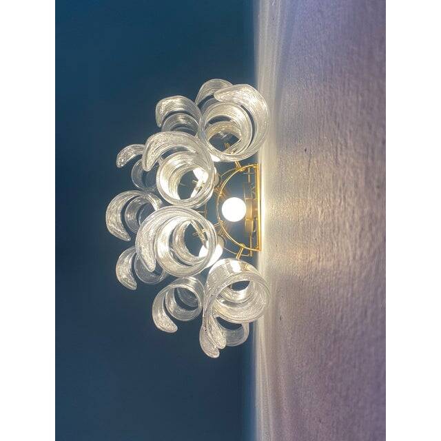 A pair of contemporary transparent “ricci” murano glass wall sconces