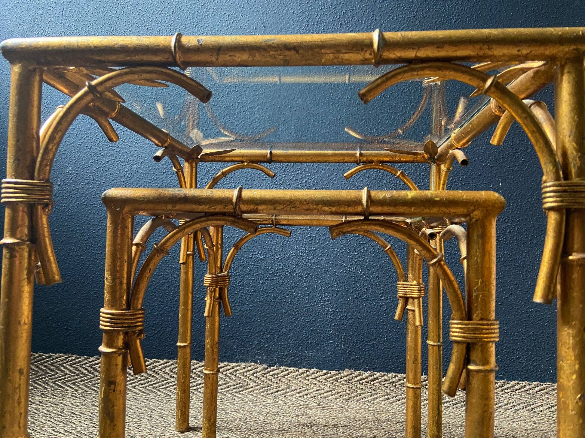 Pair of nesting tables in faux bamboo with glass tops, France, 1960s.