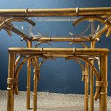 Pair of nesting tables in faux bamboo with glass tops, France, 1960s.