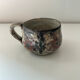 Handcrafted mug with floral decoration