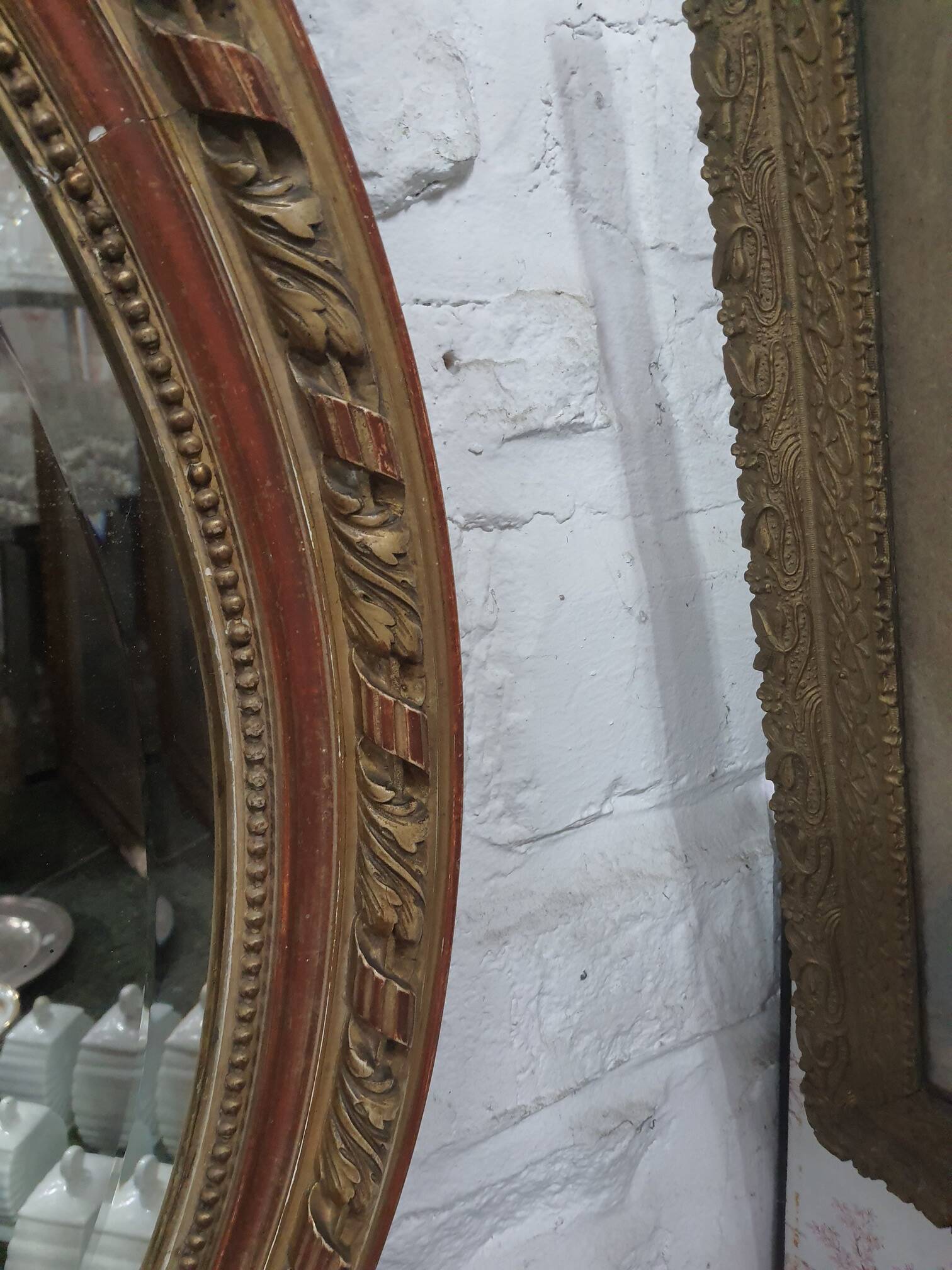 Golden oval mirror