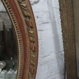 Golden oval mirror