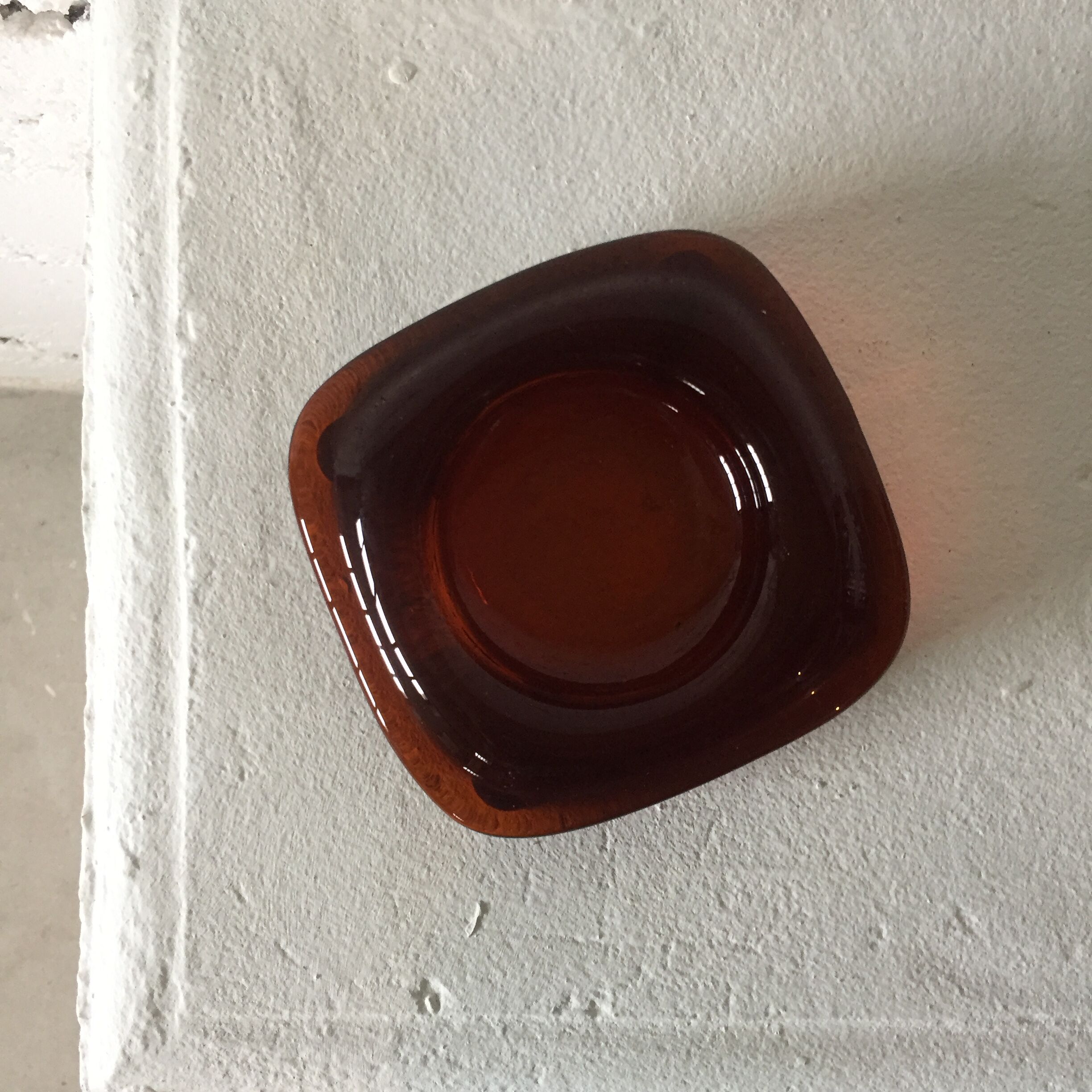 Brown glass ashtray