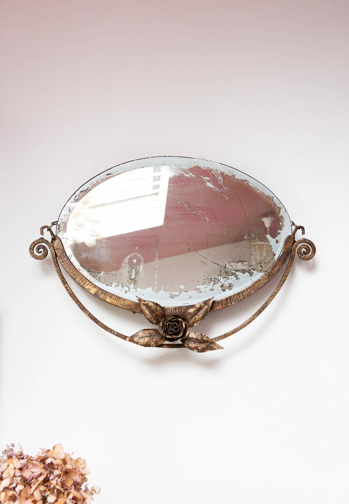 Old wrought iron mirror in the art deco style and period