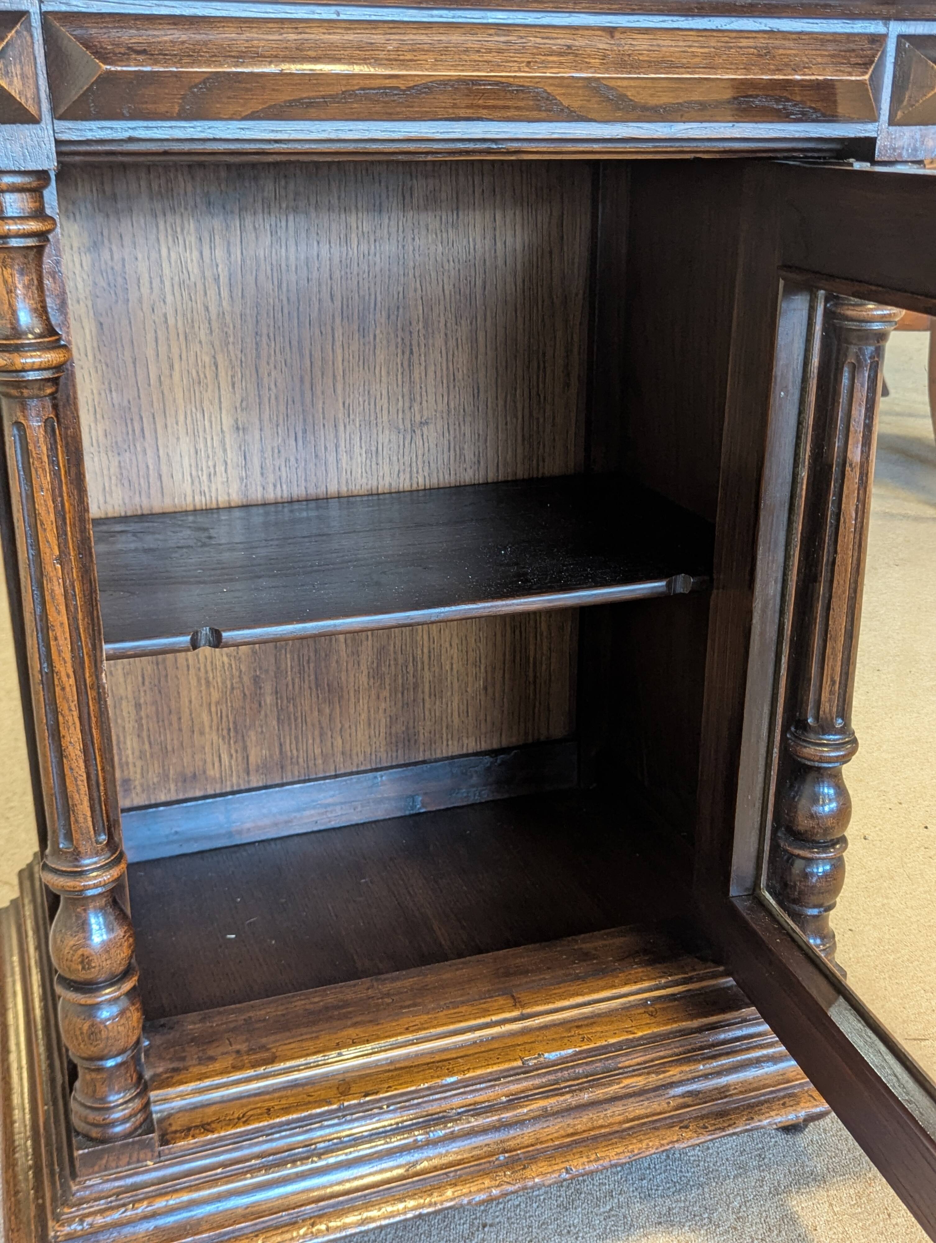Two-body display cabinet in oak, Henri II style.