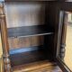 Two-body display cabinet in oak, Henri II style.