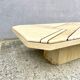 Low table in travertine and onyx 80'