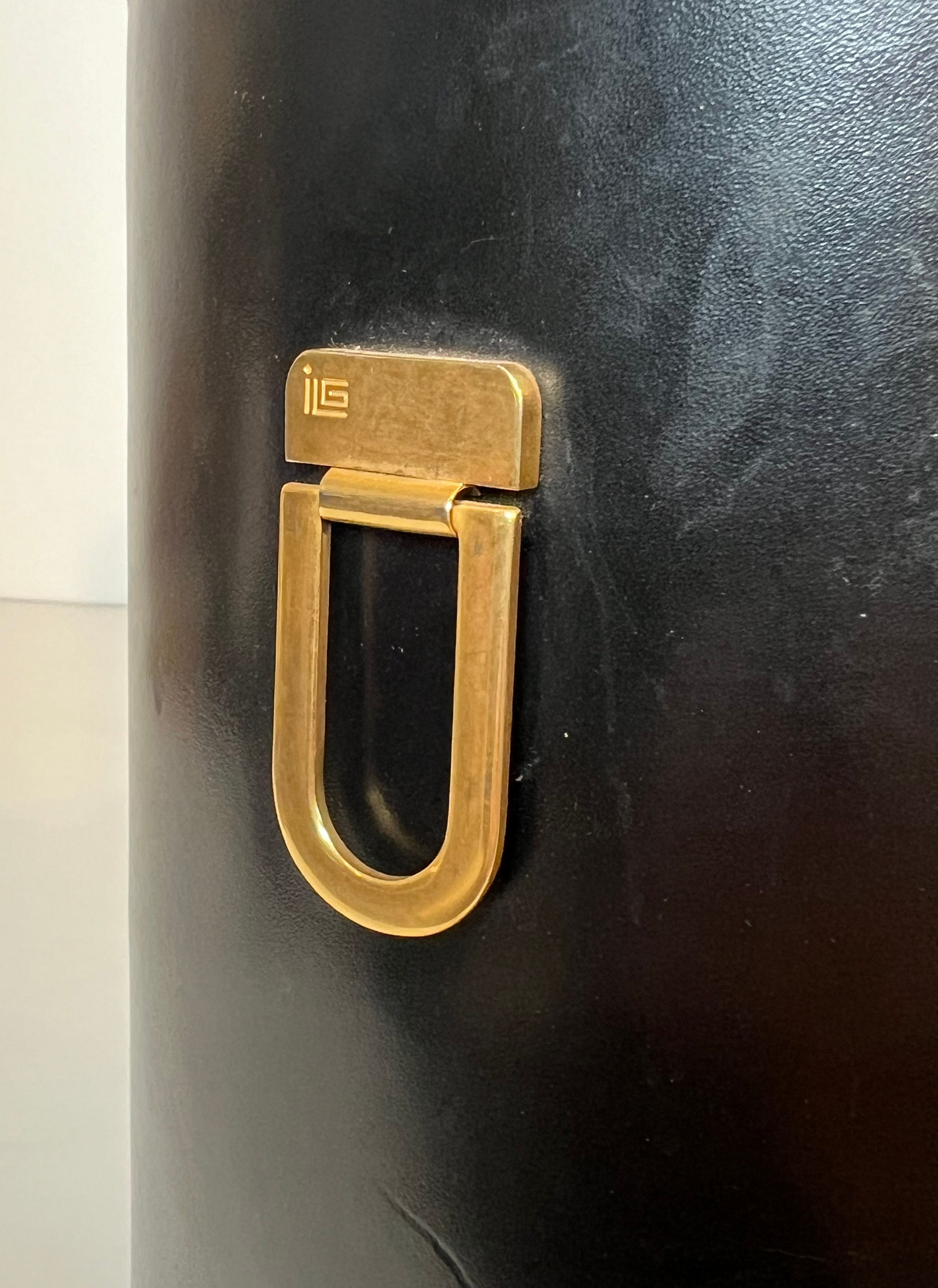 Black leather and brass desk basket