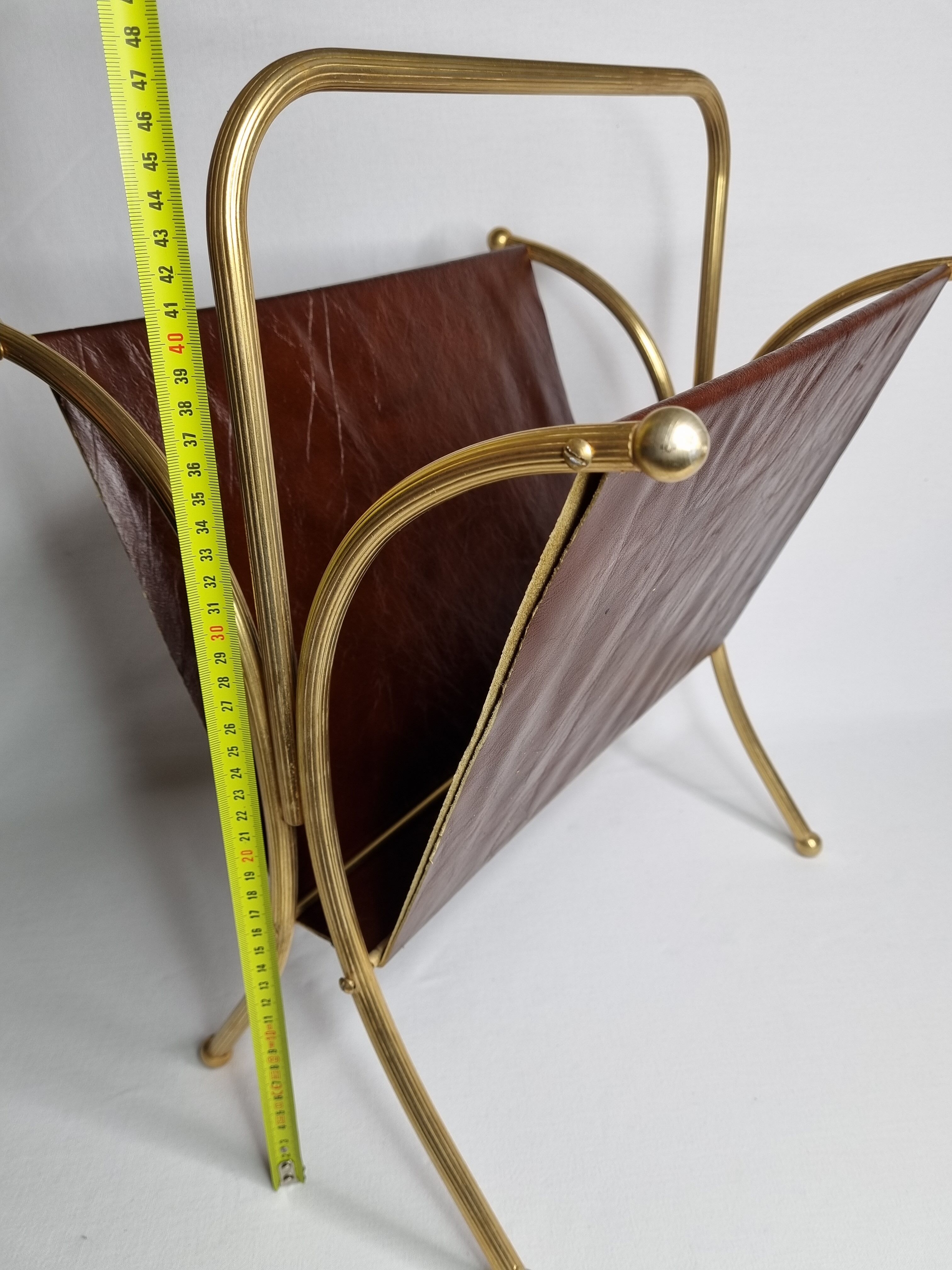 Vintage magazines and gold and leather brass